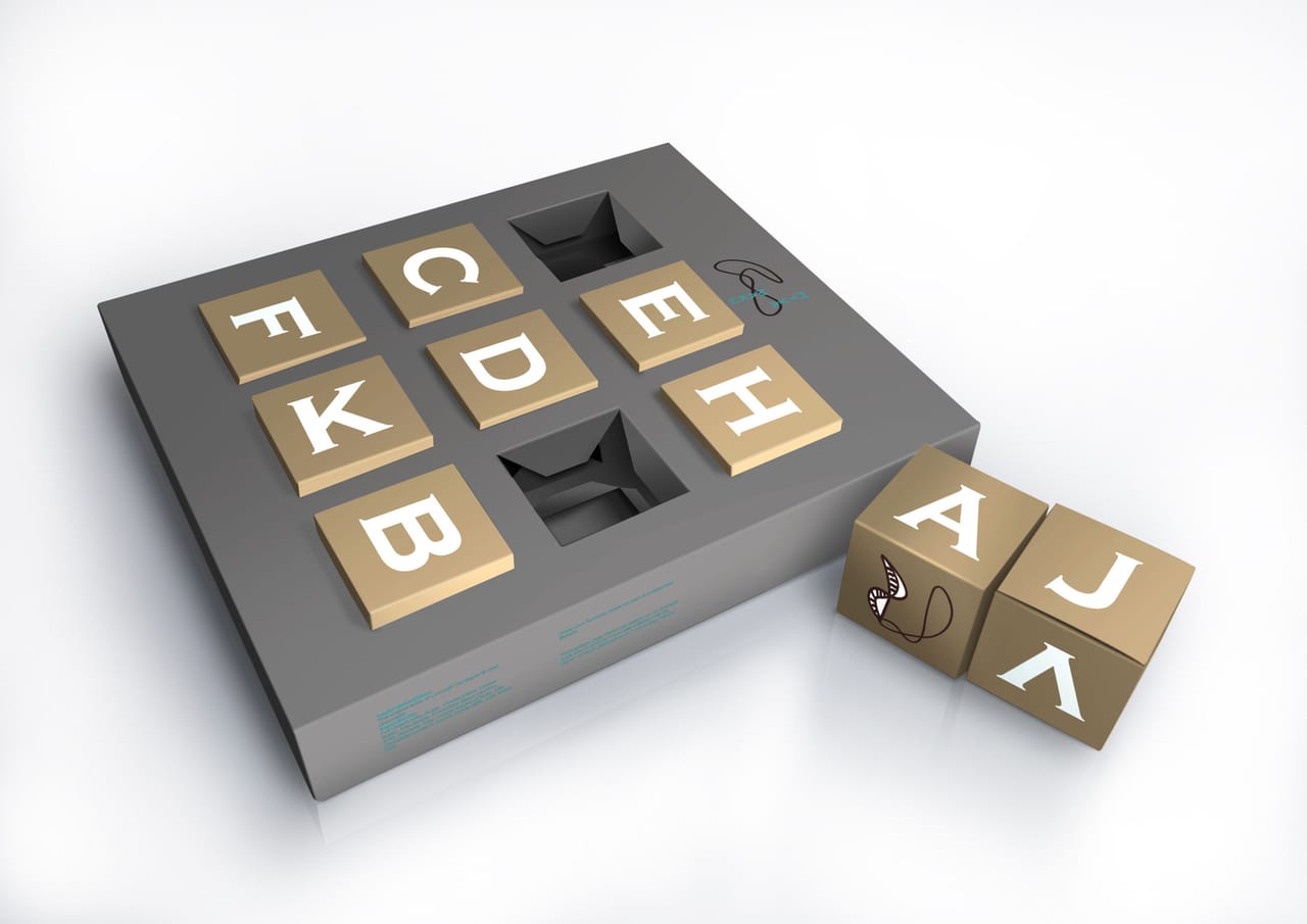 HY CHOCOLATE: letter-tile packaging box — Gloss Design, Macau graphic design studio